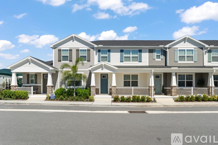 A row of houses with the first one having a blue door.
