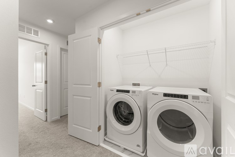 Two washing machines in a laundry room.