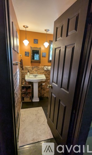 A bathroom with a sink and a mirror.