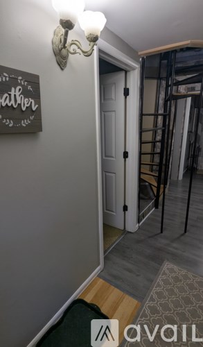 A hallway with a door and a sign that says "father".