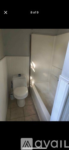 A bathroom with a toilet and a bidet.