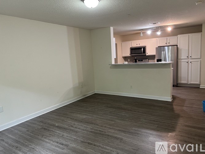 A kitchen area with a countertop and cabinets.
