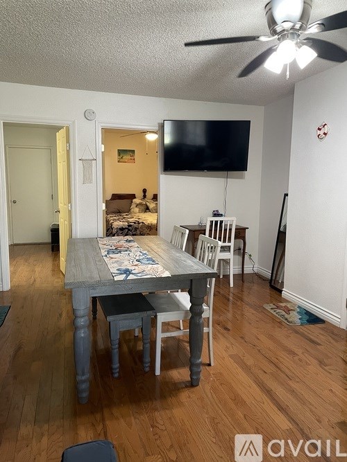 A room with a table and chairs in it.