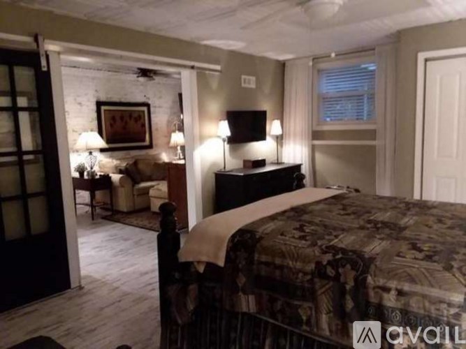 Source URL: https://prod-avail.s3.amazonaws.com/public_images/41512903/listing/EW_Bsmt_Ad_Pics_Bed_Dresser_View_of_LR_Couch__Oct_25.png