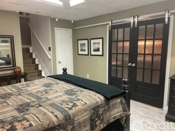 Source URL: https://prod-avail.s3.amazonaws.com/public_images/41512924/listing/EW_Bsmt_Ad_Pics_Black_Doors_and_Bed_and_Stairs__Oct_25.png