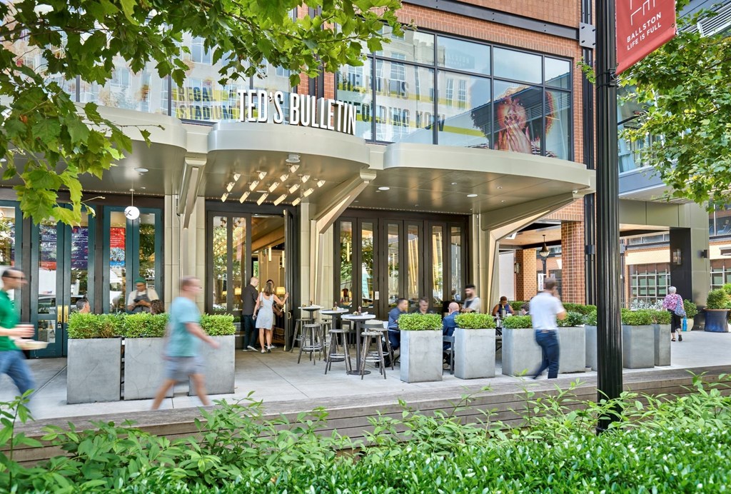 A Ted's Bulletin storefront with people walking by.