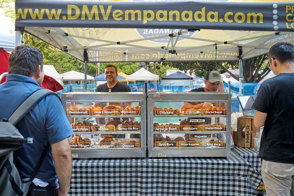 A food stand with a menu on the table.