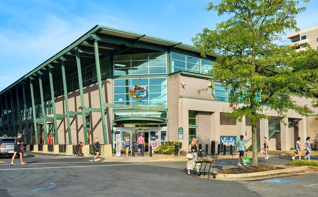 A building with a green roof and a sign that says "STOP" on it.