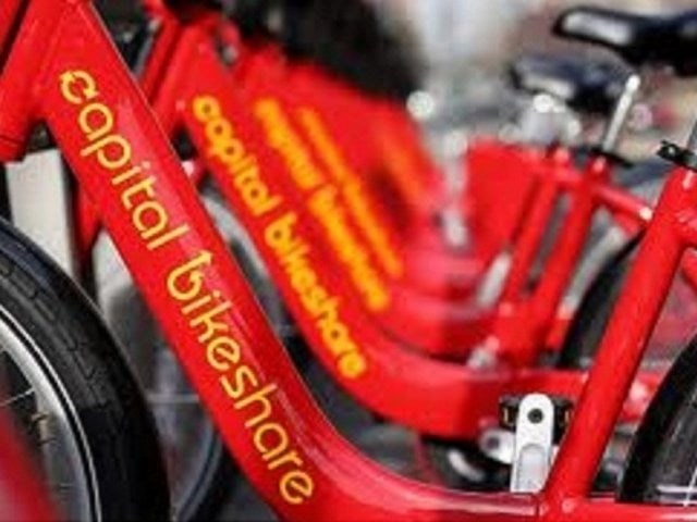 A red bicycle with the words "Capital Bikeshare" written on it.