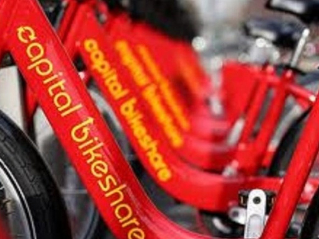 A red bicycle with the words "Capital Bikeshares" written on it.