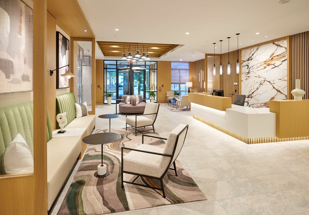 A modern living room with a green sofa and a coffee table.