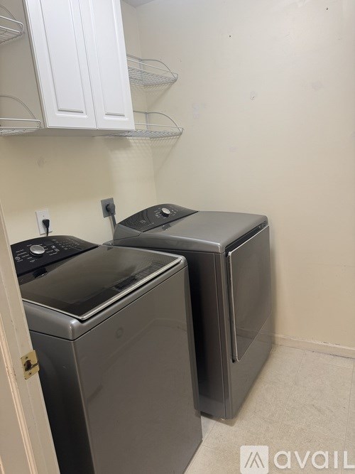 A laundry room with a washer and dryer.