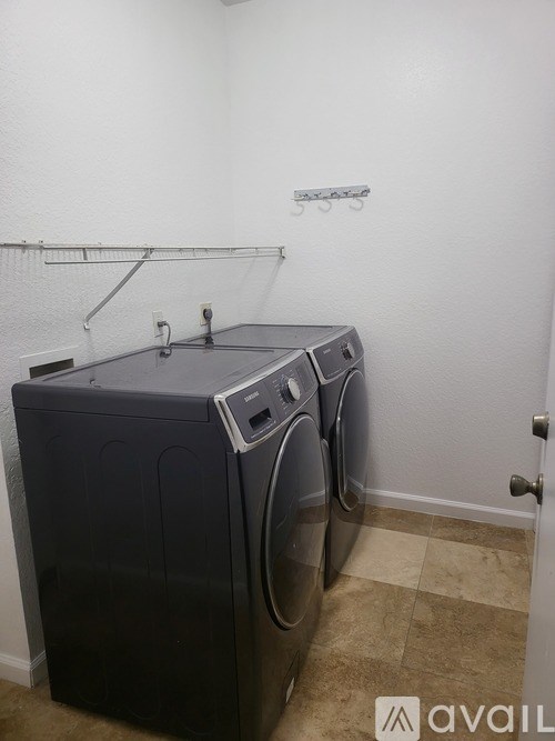 A laundry room with a washer and dryer.