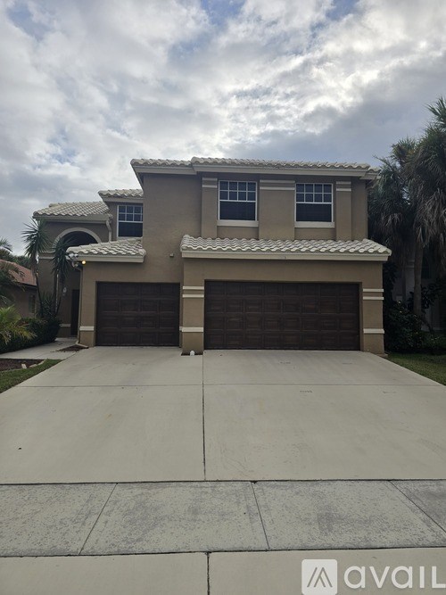 A house with a driveway in front of it.