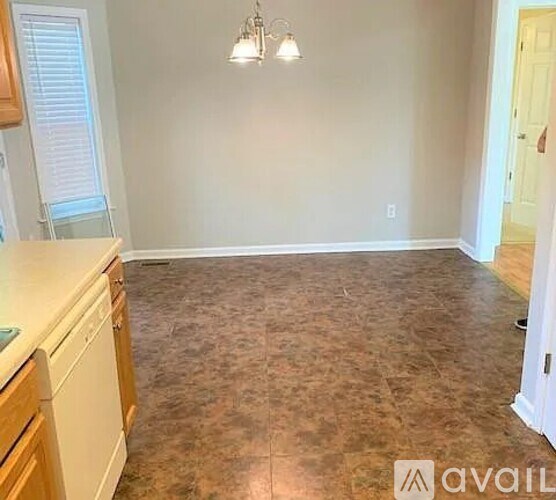 A kitchen with a washer and dryer in it.