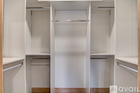 Closet with shelves and a hanging rail.