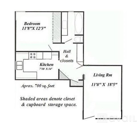 A floor plan of a small apartment with a bedroom, kitchen, and living room.