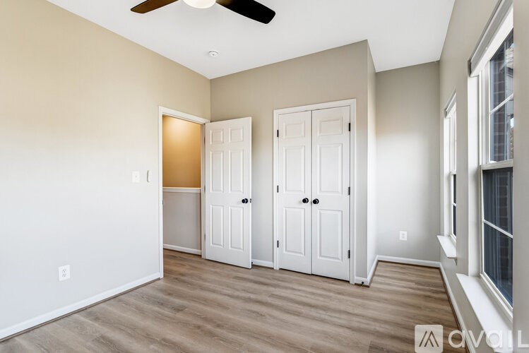 A bathroom with a toilet, sink, and shower.
