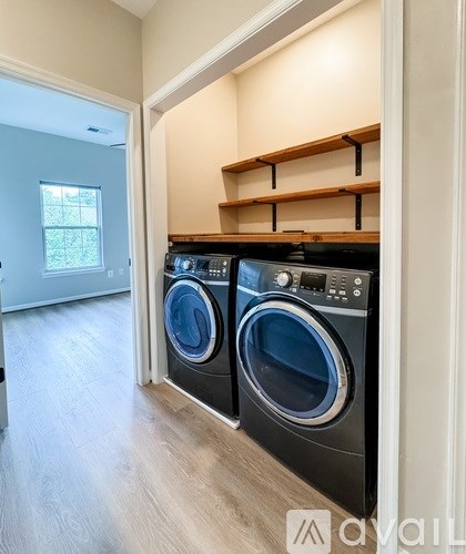 A laundry room with a washer and dryer.