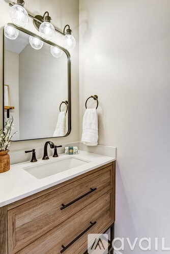 A hallway with two doors and a staircase.