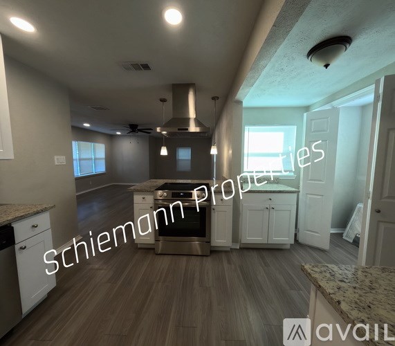 A kitchen interior with the text "Schiemann Properties" overlaid on the image.