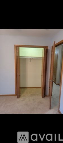 A room with a doorway leading to another room.