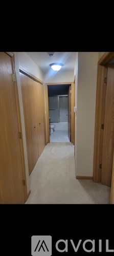 A long hallway with doors on both sides.