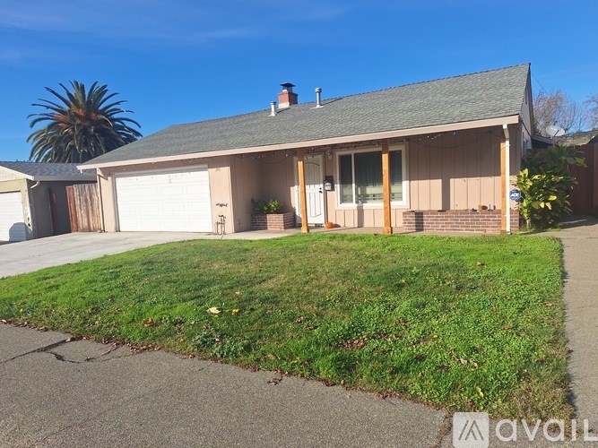 A house with a garage and a driveway.