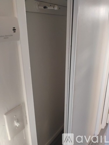 A white door with a handle and a window.