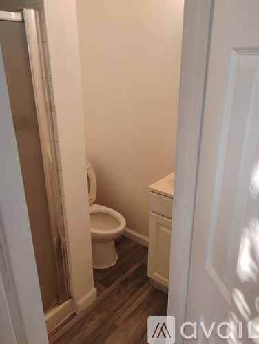 A bathroom with a toilet and sink.