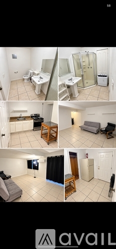 A bathroom with a glass shower door and a white wall.