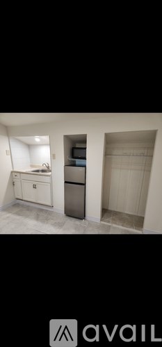 A kitchen with a white countertop and a white drawer.