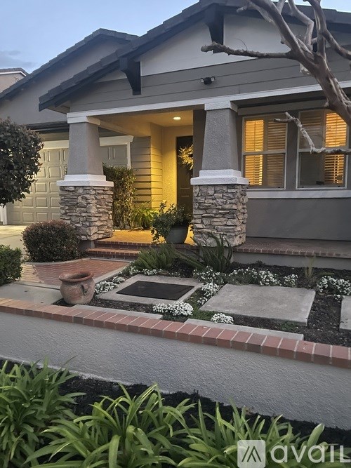 A house with a front yard and a small garden.