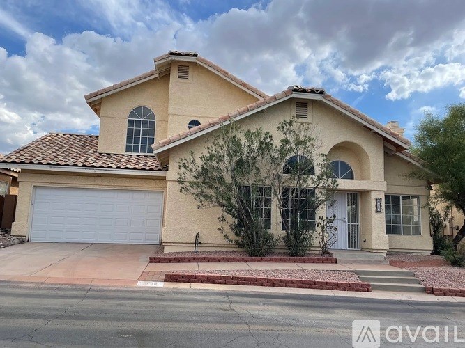 A house with a white garage door and a red roof.