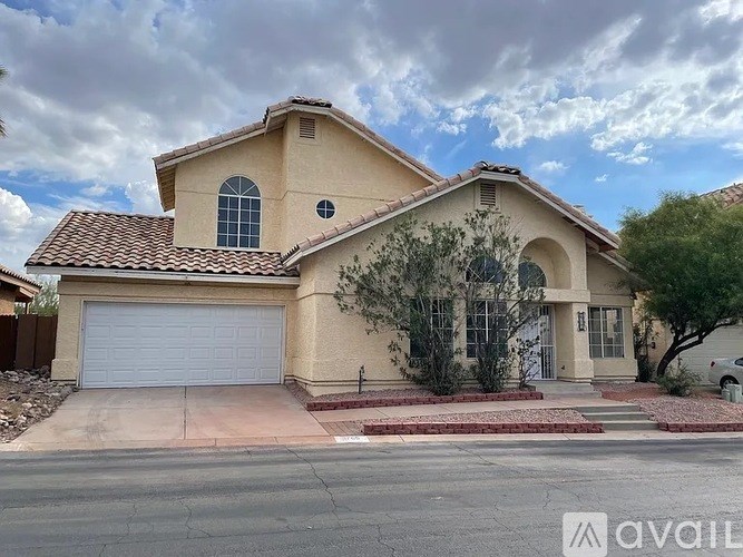 A house with a garage is for sale.