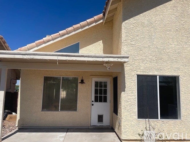A house with a white door and windows.