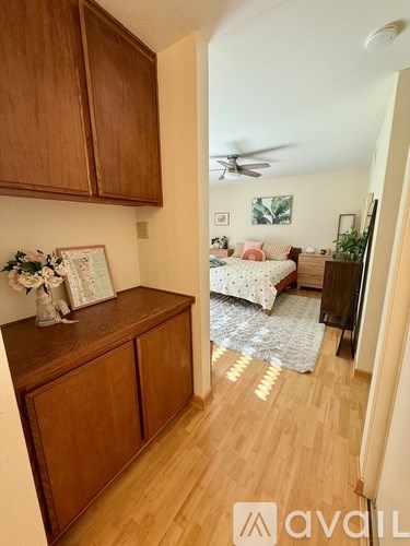 A room with wooden floors and furniture.