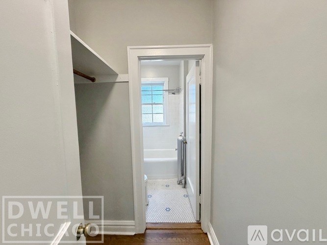 A white door in a room with a white wall.