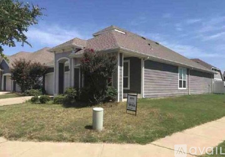 A house with a sign in front of it.