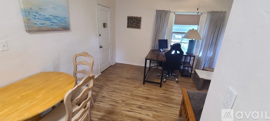 A room with a desk and a chair.