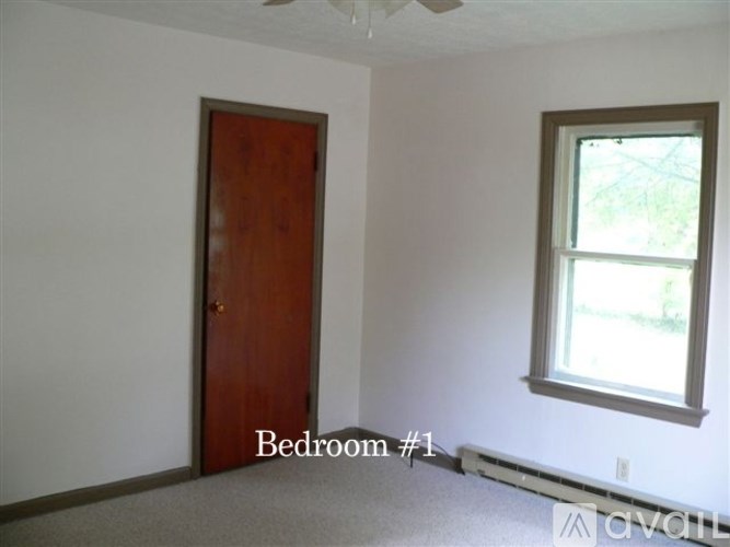 A room with a door and a window.