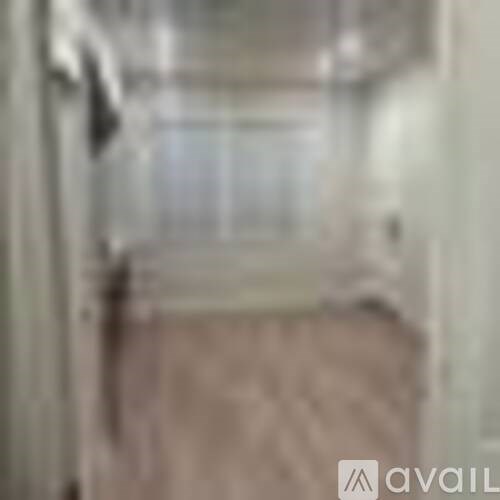 A blurry image of a room with a window.