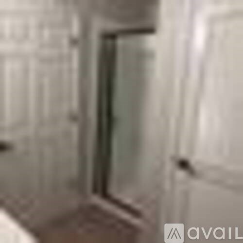 A white door is in a room.