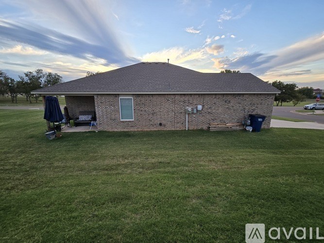 A house with a lawn in front of it.