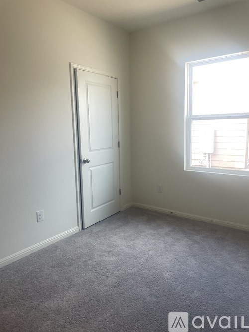 A room with a door and a window.