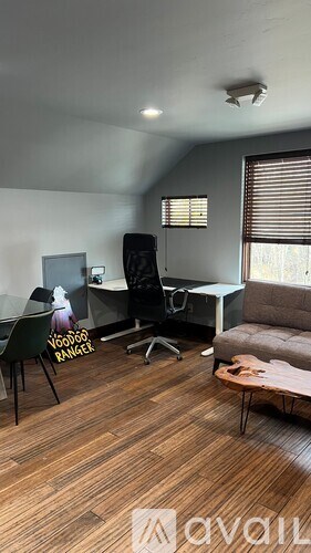 A room with a chair that has the words "Woodpecker Ranger" on it.