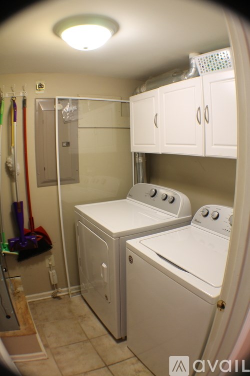 A small laundry room with a washer and dryer.