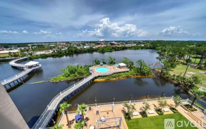 A large body of water with a dock and a pool.