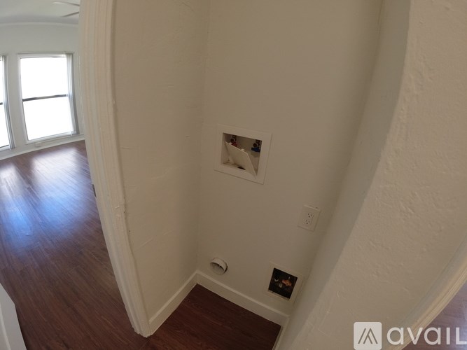 A room with a ceiling fan and a window.