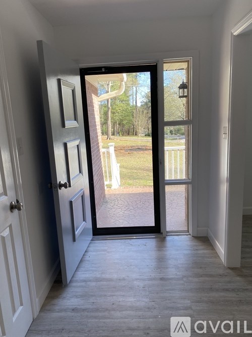 A doorway leads to a backyard.